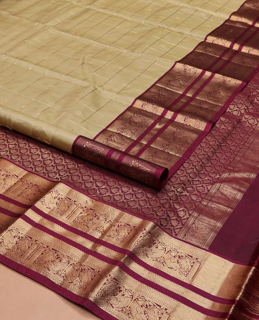 Light gold zari buttas and checked silk saree, contrast border of banaras, mayil kann, and mayil designs, and zari-rich jaal pallu