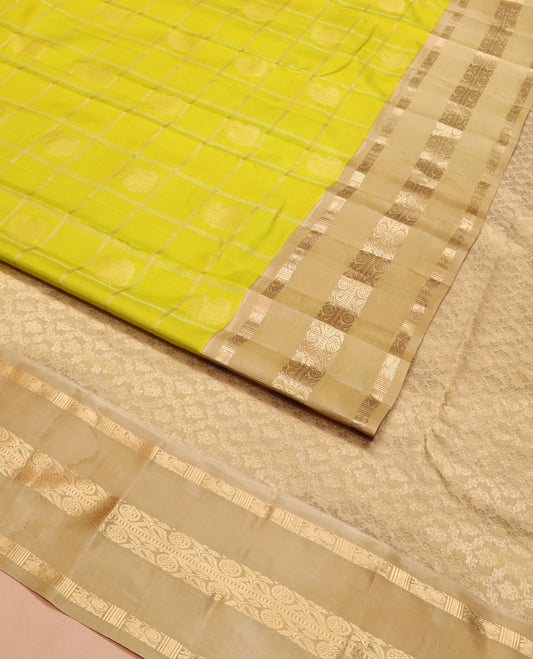 Green zari butta enclosed checked silk saree, contrast border of mayil chakram and muthu stripes, and jaal pallu