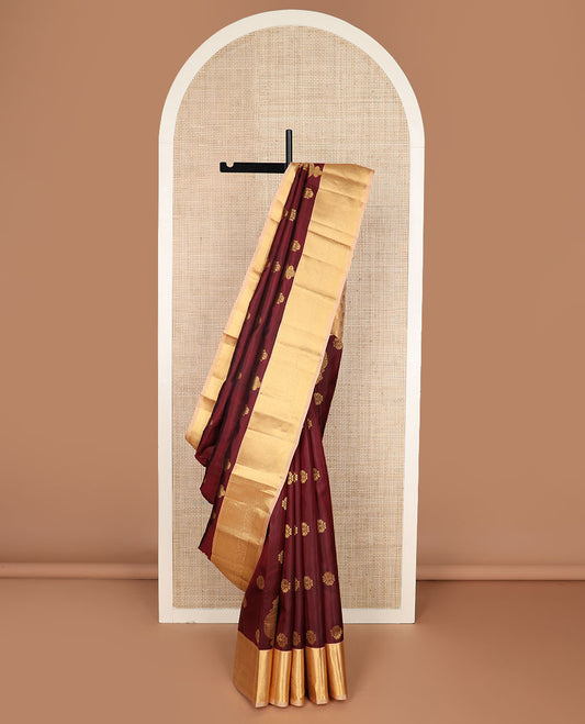 Maroon zari buttas silk saree, contrast border of salangai, ara bogudi, mayil kann & kodi visiry & seppu rekku pallu of floral motifs
