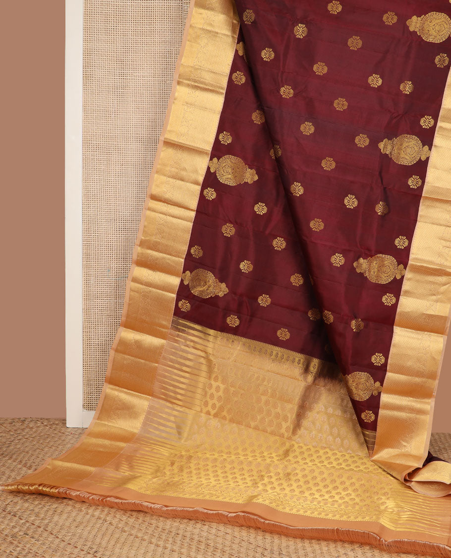 Maroon zari buttas silk saree, contrast border of salangai, ara bogudi, mayil kann & kodi visiry & seppu rekku pallu of floral motifs