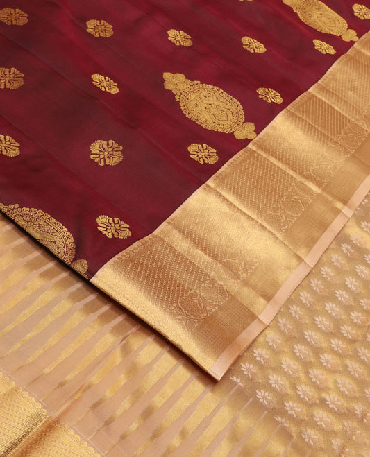 Maroon zari buttas silk saree, contrast border of salangai, ara bogudi, mayil kann & kodi visiry & seppu rekku pallu of floral motifs