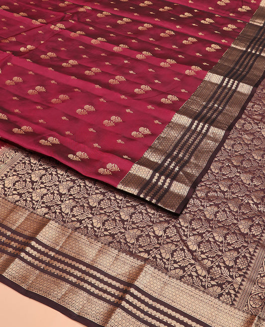 Light Maroon Vasundhara Silk Saree Gracefully Embellished with Zari Buttas, Complemented by a Contrast Border of Geometric Designs, Majestically Detailed Pallu of Floral Jaal Designs, and a Contrast Blouse