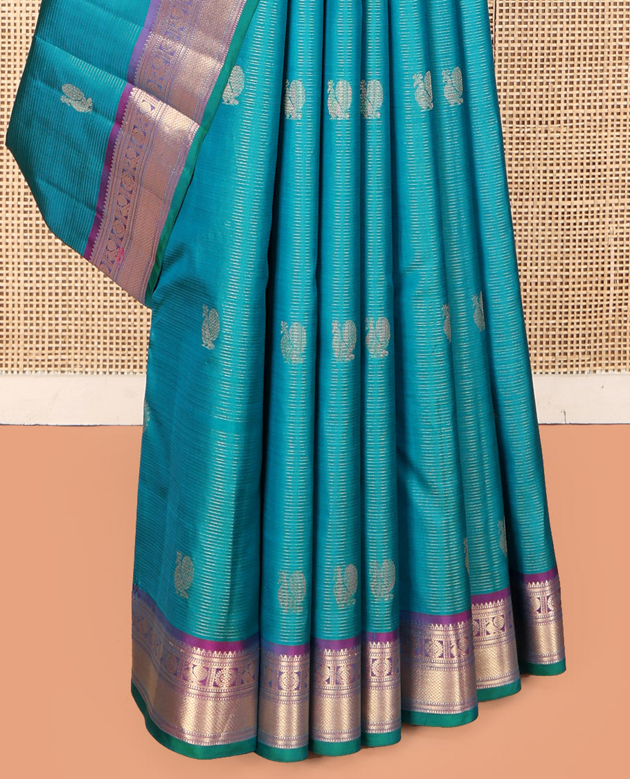 Blue Vasundhara Silk Saree, Embellished with Mayil-Chakra Buttas, Complemented by a Contrast Border of Rekku, Muthu, Kathir, Mayil, Chakram, and Mayil Kann, Jaal Pallu, and a Contrast Blouse
