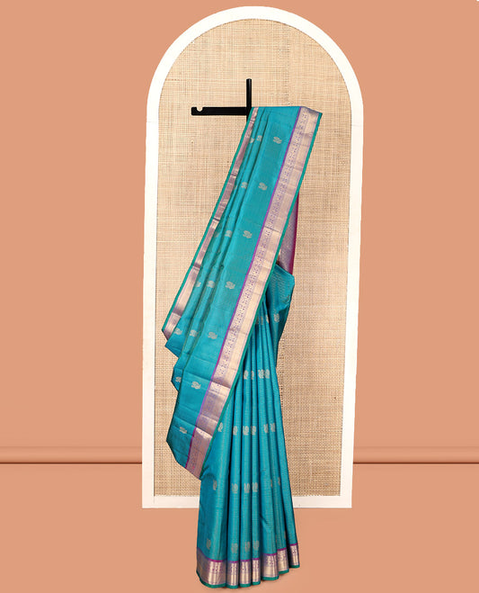 Blue Vasundhara Silk Saree, Embellished with Mayil-Chakra Buttas, Complemented by a Contrast Border of Rekku, Muthu, Kathir, Mayil, Chakram, and Mayil Kann, Jaal Pallu, and a Contrast Blouse