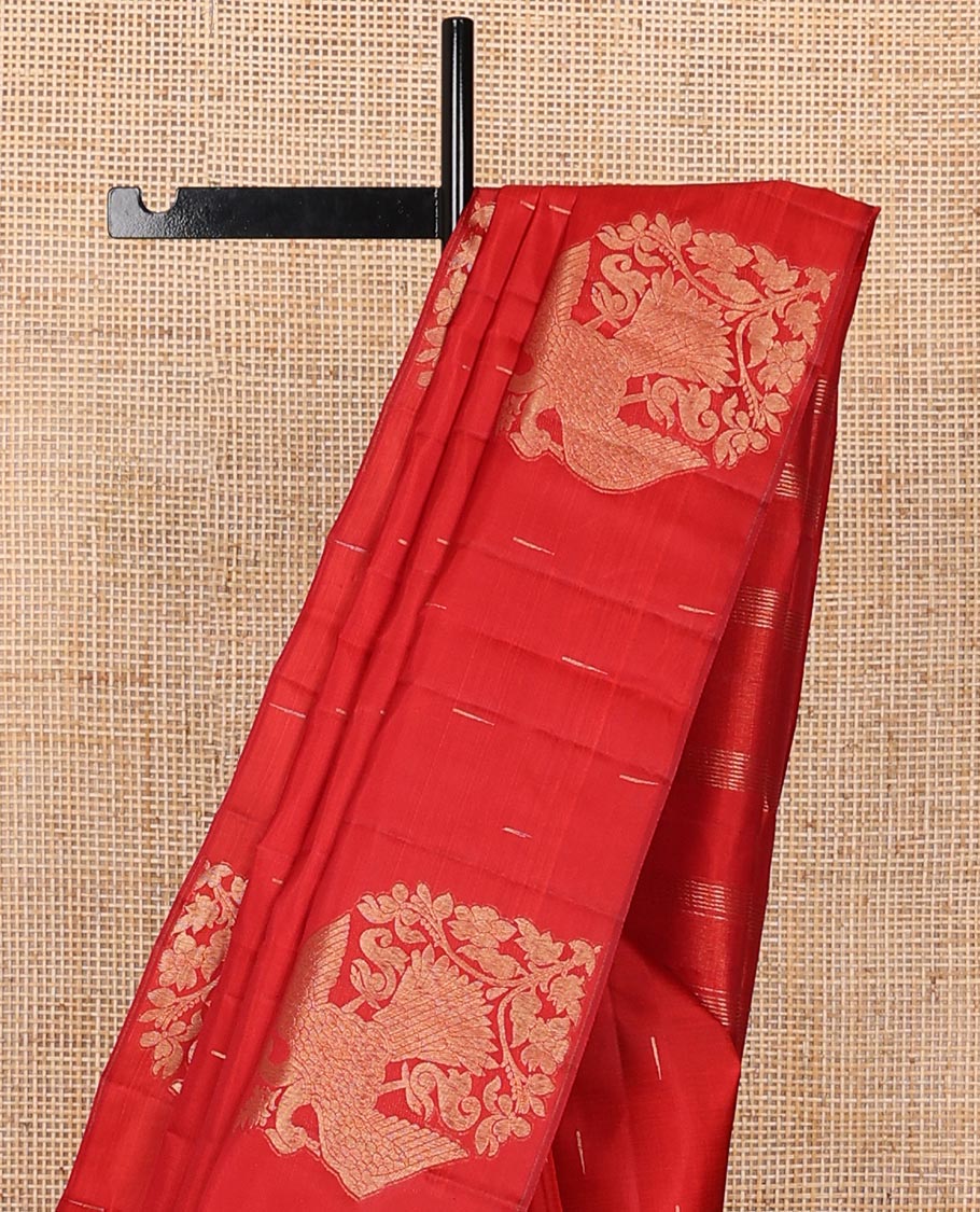 Borderless red silk saree with malli mokku and iruthalai pakshi buttas, self-pallu of zari stripes