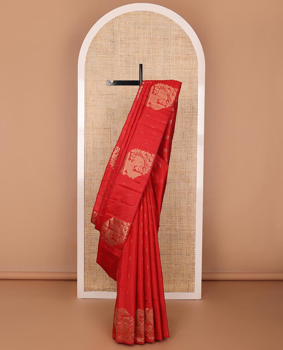 Borderless red silk saree with malli mokku and iruthalai pakshi buttas, self-pallu of zari stripes