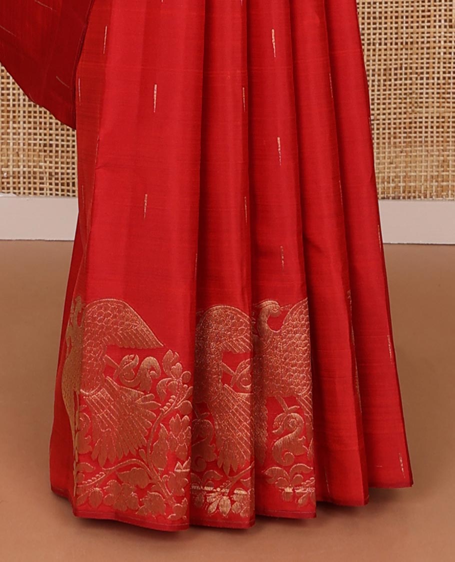 Borderless red silk saree with malli mokku and iruthalai pakshi buttas, self-pallu of zari stripes