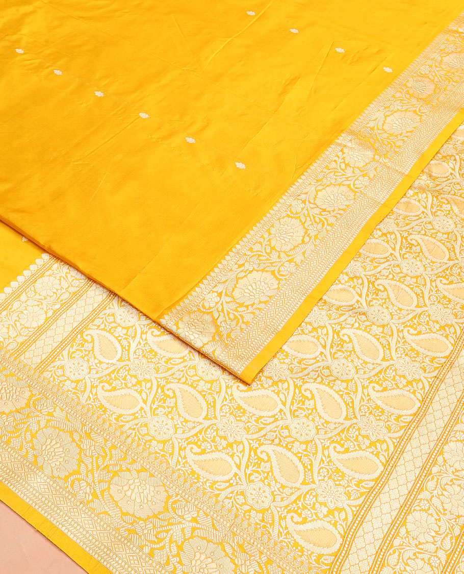Yellow buttas banarasi kathan silk saree,  floral creeper  border, and pallu of paisley jaal design