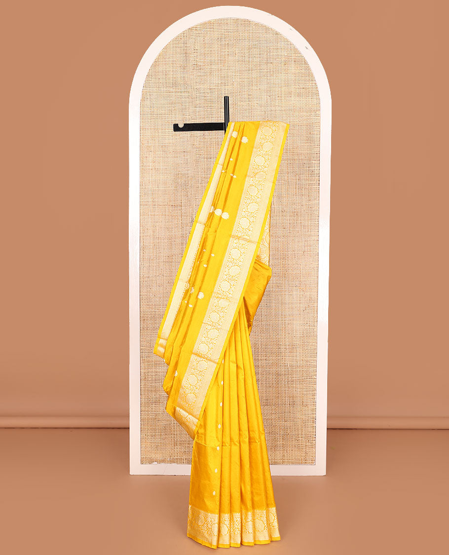 Yellow buttas banarasi kathan silk saree,  floral creeper  border, and pallu of paisley jaal design