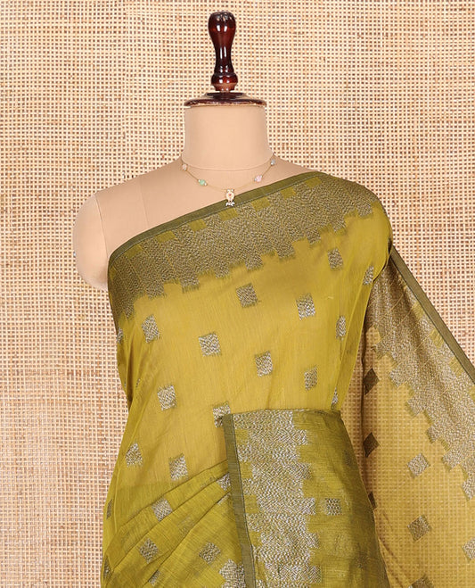 Green Semi-Silk Cotton Saree, Woven with Zari Buttas All Over Its Body, Gleaming Zari Design Border, Intricately Zari-Designed Pallu, and Paired with a Matching Blouse