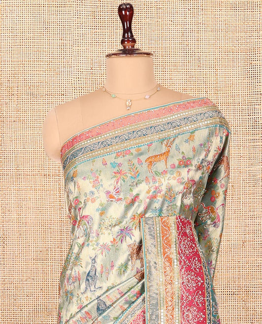 Blue Dola Silk Saree, Gracefully Embellished with Floral and Fauna Design on Its Body, Highlighted by Traditional Motif Stone Work Border, Pallu of Paisley Design, and Paired with a Contrast Blouse