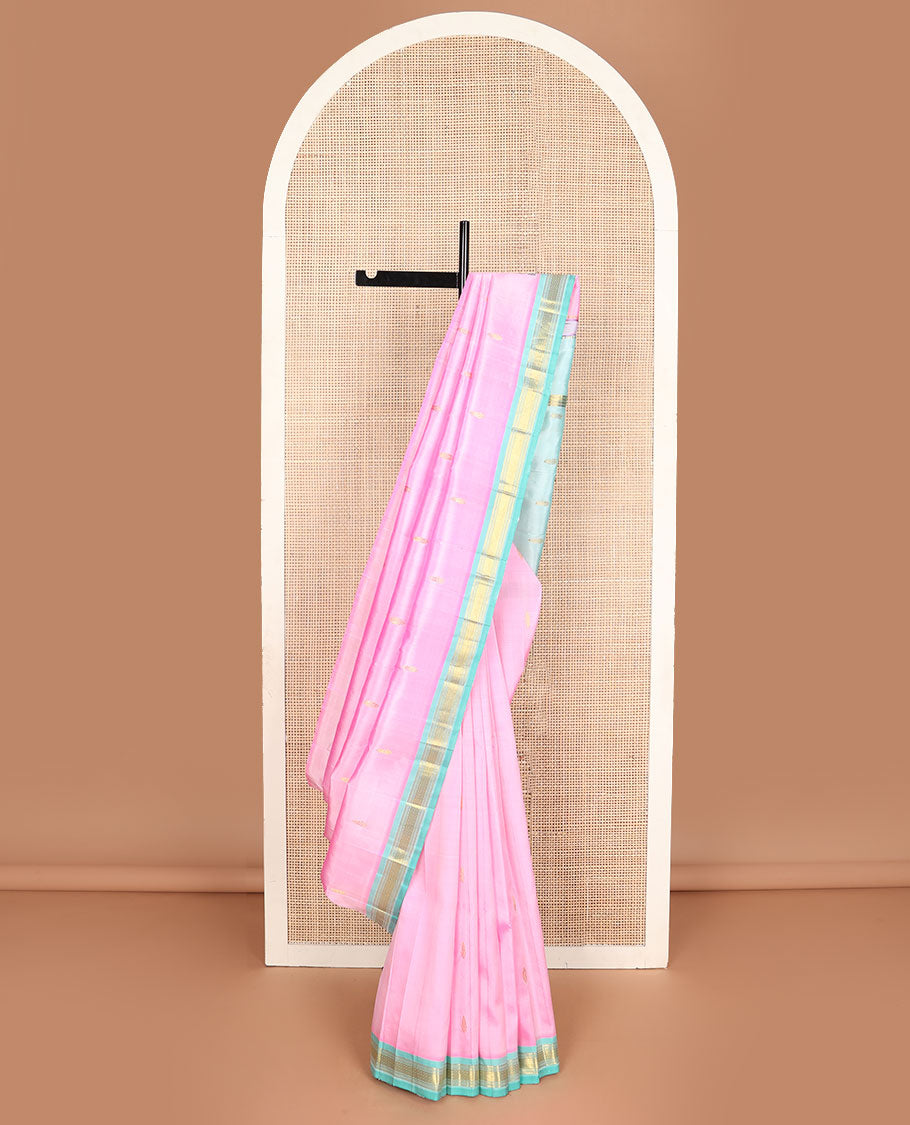 Pink kanchipuram silksaree with zari buttas, contrast one-sided zari border of Banaras, muthu & mayil kann & pallu of zari design