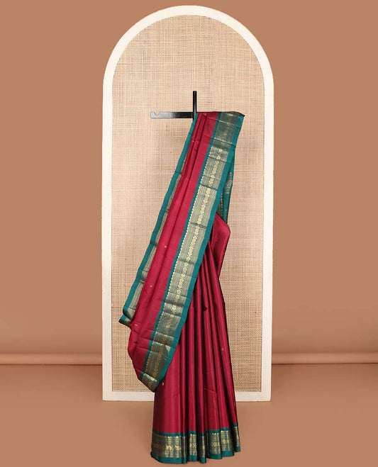 Red zari buttas Kanchipuram silk saree, contrast border of rekku, neli, muthu, jadai nagam, and diamond designs and traditional zari woven pallu
