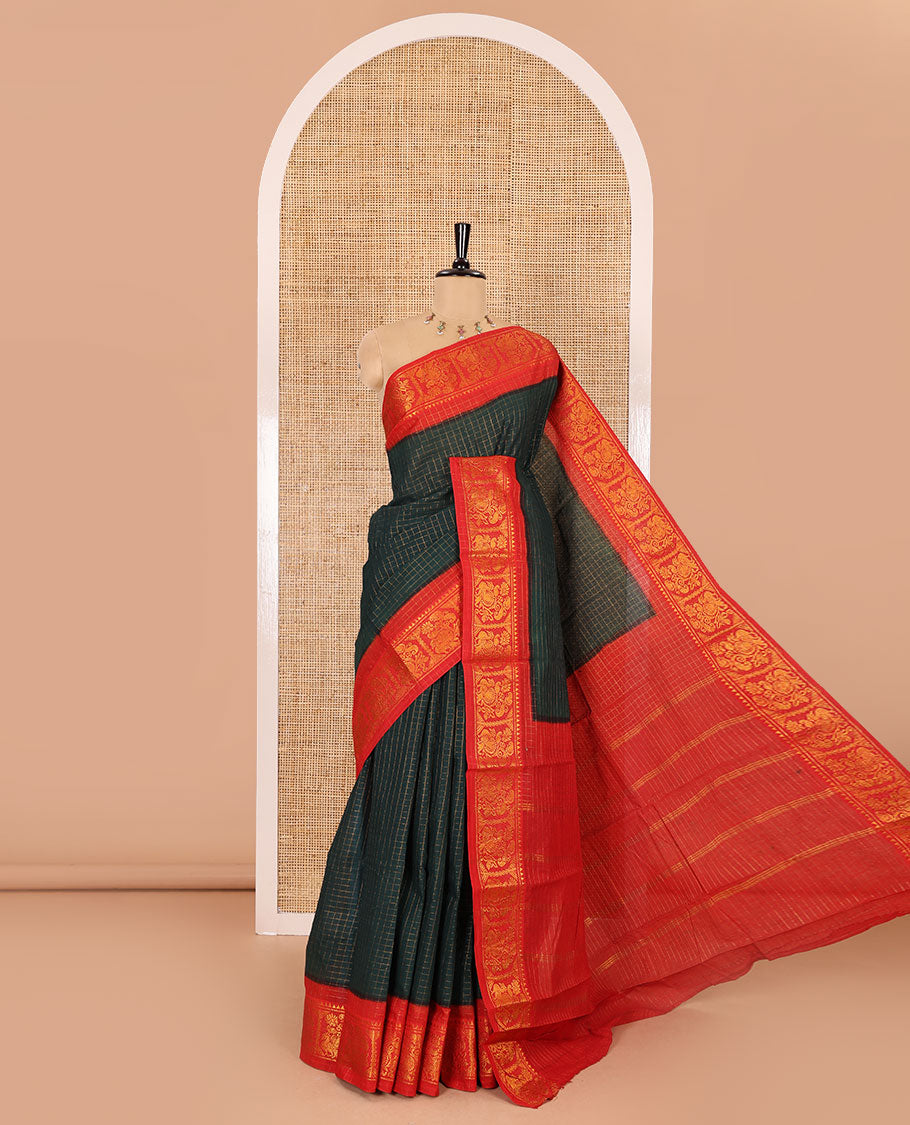Bottle green checked sungudi cotton saree, contrast zari border of peacock motifs, zari striped pallu, and a contrast zari design blouse