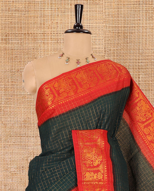 Bottle green checked sungudi cotton saree, contrast zari border of peacock motifs, zari striped pallu, and a contrast zari design blouse