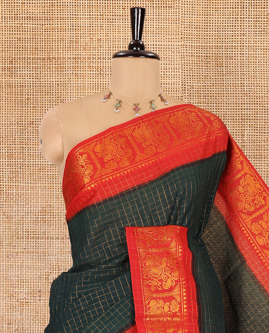Bottle green checked sungudi cotton saree, contrast zari border of peacock motifs, zari striped pallu, and a contrast zari design blouse
