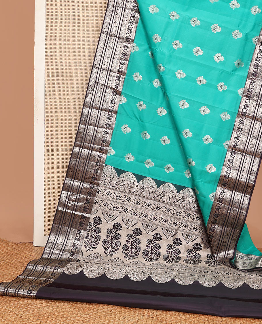Light blue zari buttas Vasundhara silk mix saree, contrast temple border of kodi visiry, kathir & Annam chakram & intricate pallu