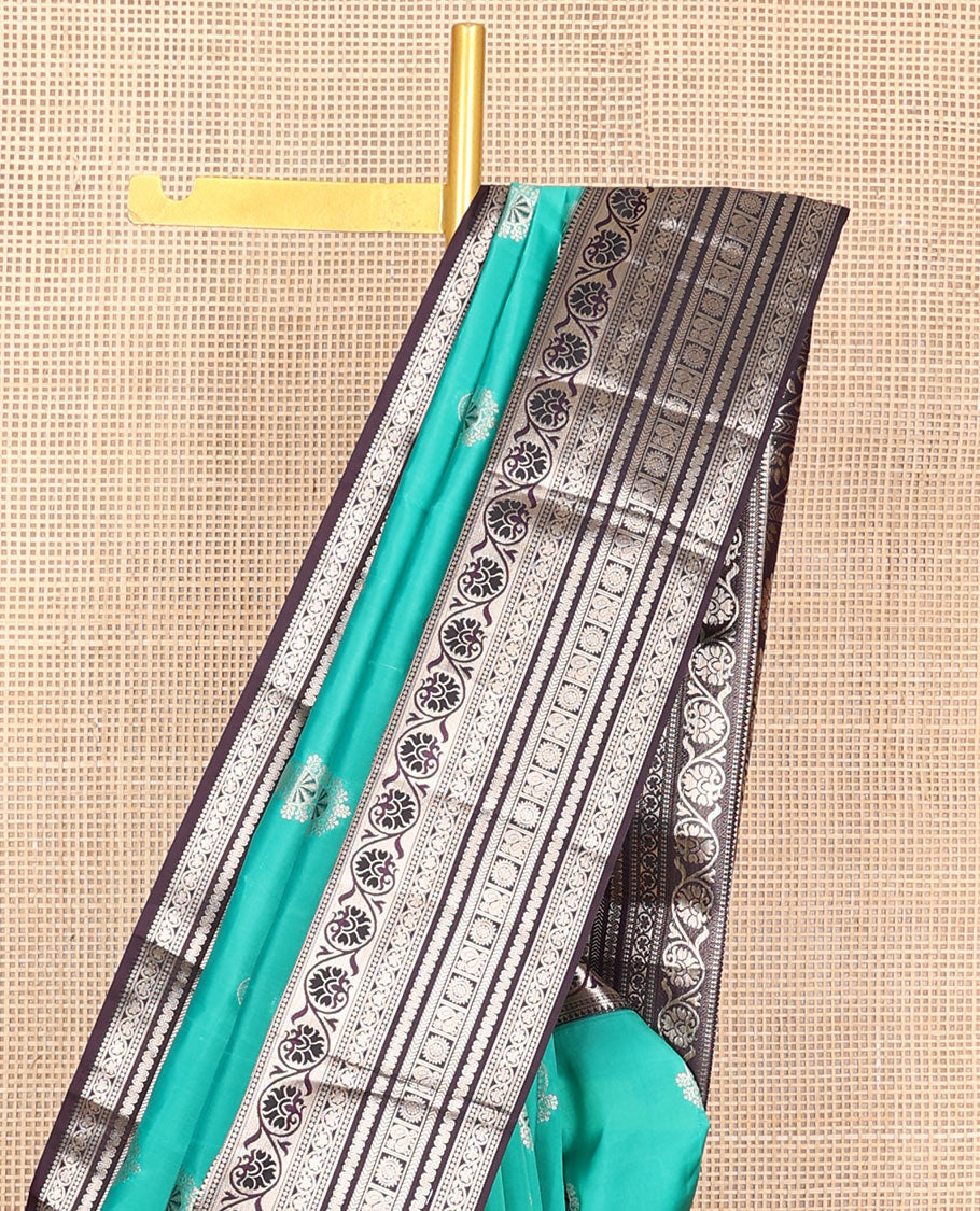 Light blue zari buttas Vasundhara silk mix saree, contrast temple border of kodi visiry, kathir & Annam chakram & intricate pallu