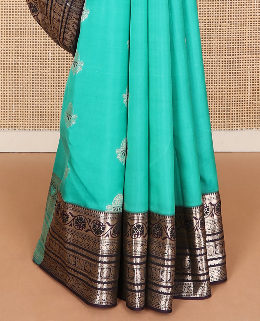 Light blue zari buttas Vasundhara silk mix saree, contrast temple border of kodi visiry, kathir & Annam chakram & intricate pallu