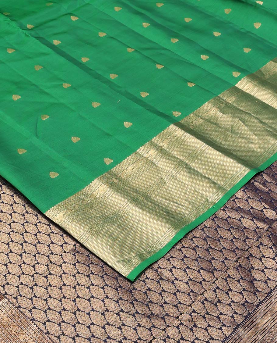 Green rettai manga buttas Vasundhara silk mix saree, traditional design zari border, and contrast intricate pallu