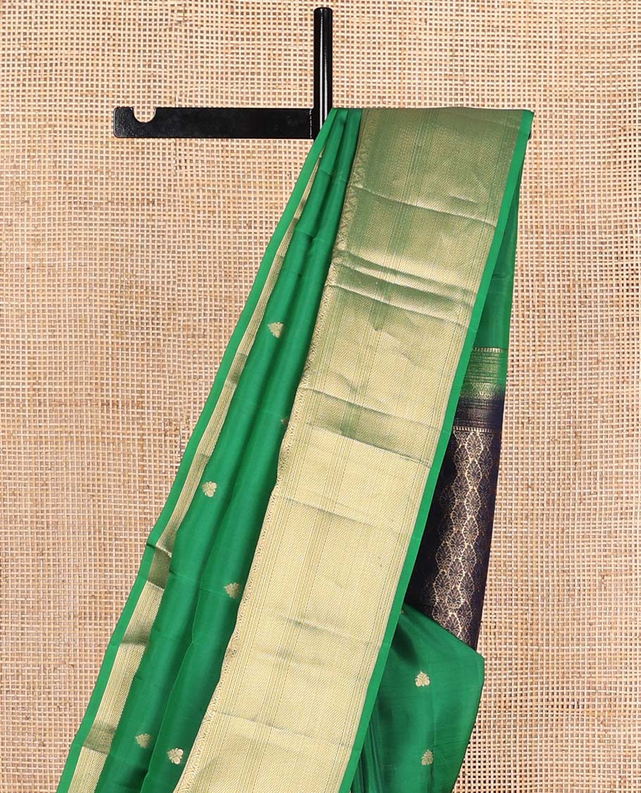 Green rettai manga buttas Vasundhara silk mix saree, traditional design zari border, and contrast intricate pallu