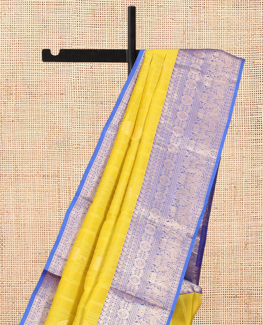 Green Vasundhara Lite Silk Mix Saree, Decked Up with Zari Designs, a Contrast Border of Manga Mokku, Rudraksham, Chakram, and Mayil Designs, Grand Pallu, and a Contrast Blouse