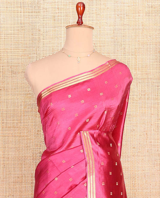 Candy Pink Banana Pith Saree Enlivened with Square-Shaped Zari Buttas, Subtly Woven Zari Piping Border, Pallu Gleamed Up with Zari Stripes, and Paired with a Matching Blouse