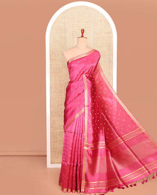 Candy Pink Banana Pith Saree Enlivened with Square-Shaped Zari Buttas, Subtly Woven Zari Piping Border, Pallu Gleamed Up with Zari Stripes, and Paired with a Matching Blouse