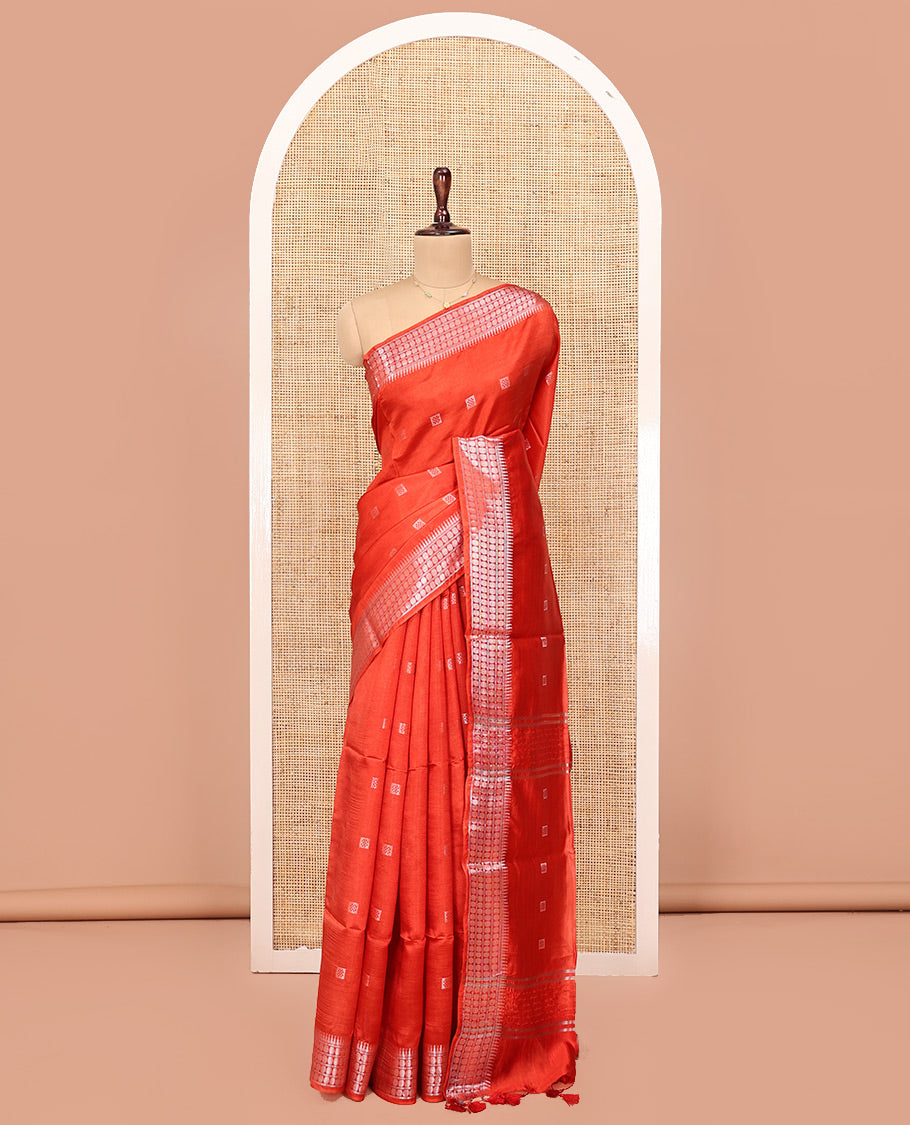 Orange Banana Pith Saree, Mesmerized with Buttas All Over Its Body, Highlighted by Self-Border of Temple and Rudraksham Motifs, Pallu Steeped with Stripes and Buttas, and Paired with a Matching Blouse