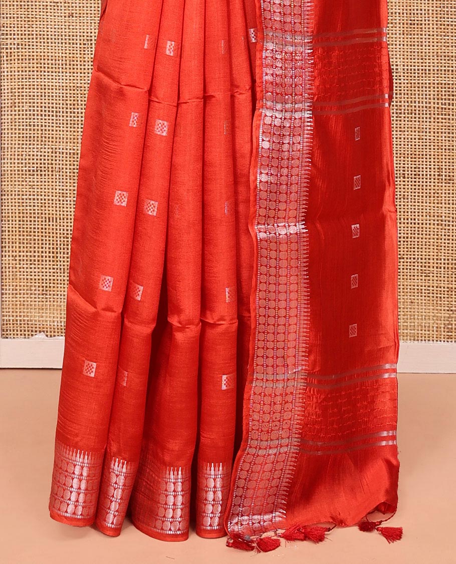 Orange Banana Pith Saree, Mesmerized with Buttas All Over Its Body, Highlighted by Self-Border of Temple and Rudraksham Motifs, Pallu Steeped with Stripes and Buttas, and Paired with a Matching Blouse