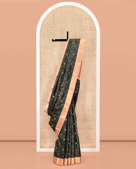 Green Vasundhara Silk Saree, Gracefully Embellished with Zari Butta Enclosed Checks All Over Its Body, Complemented by a Contrast Border of Banaras, Vanki, and Mayil Designs, Grand Pallu, and Paired with a Contrast Blouse
