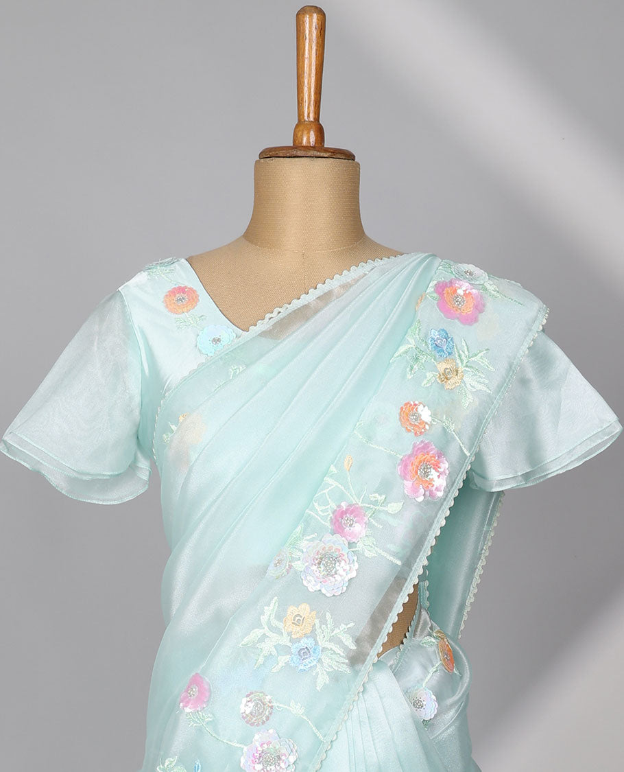Pale green plain designer catalog saree, scallop border adorned with colorful floral vine embroidery