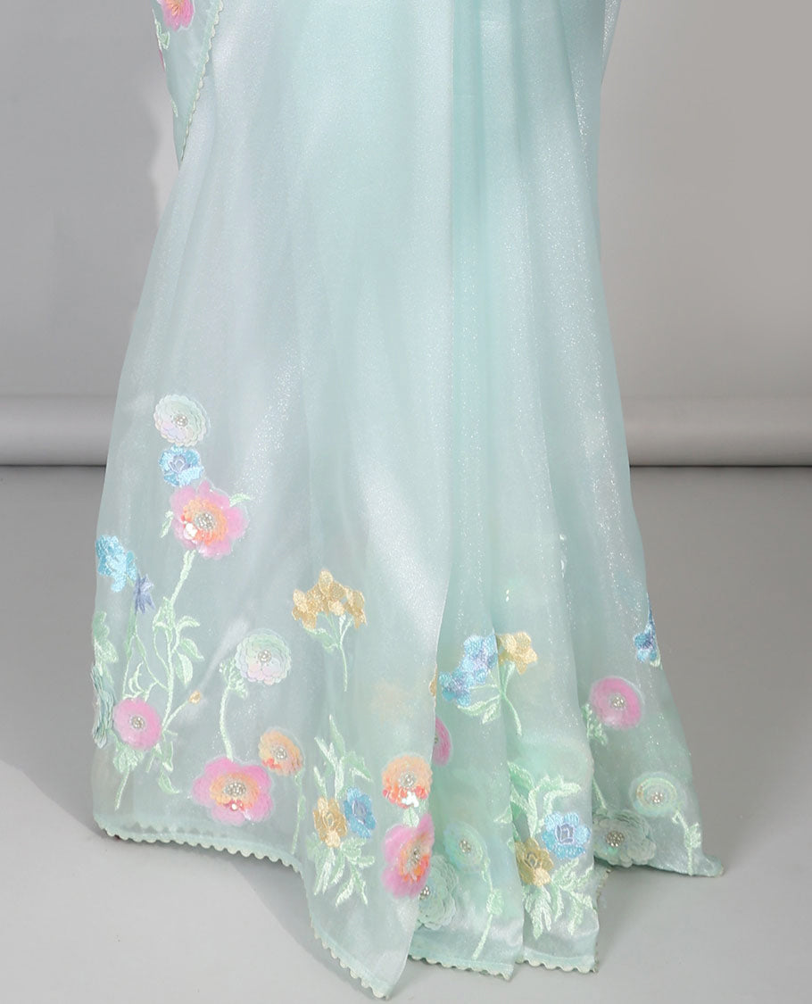 Pale green plain designer catalog saree, scallop border adorned with colorful floral vine embroidery