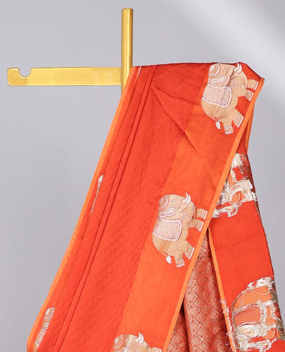 Orange jaal design mushru silk saree, elephant design border & pallu of jaal design