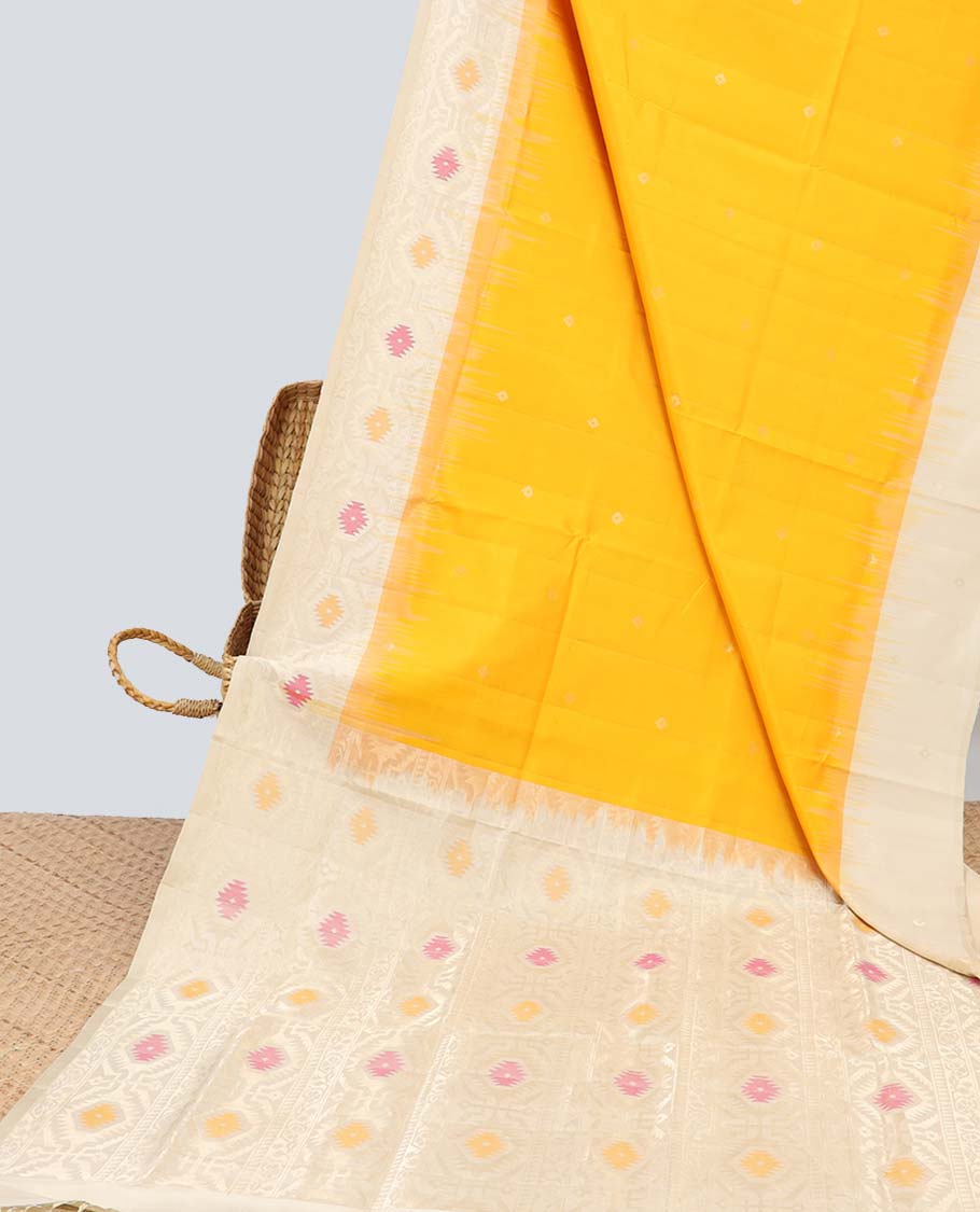 Orange soft silk saree with buttas, contrast border & pallu of patola-style meenakari designs