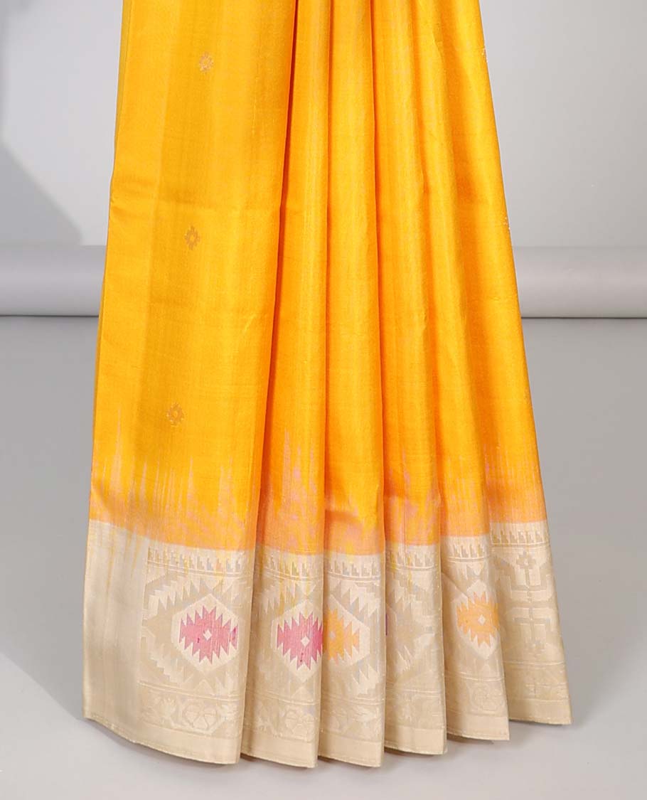 Orange soft silk saree with buttas, contrast border & pallu of patola-style meenakari designs