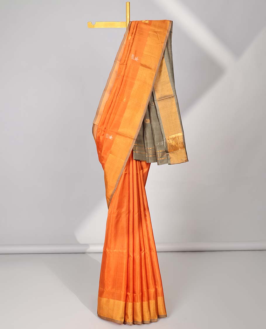 Orange uppada silk saree with floral buttas, contrast plain border & pallu of zari designs