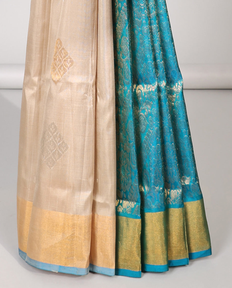 Cream uppada silk saree with buttas, contrast plain border & pallu of floral designs