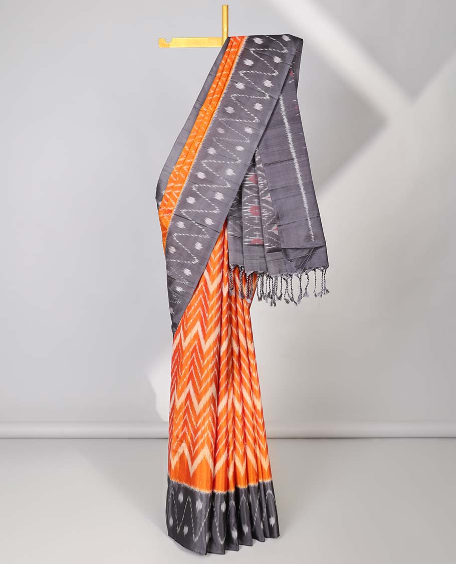 Orange ikkat-style chevron striped soft silk saree, contrast border & pallu of ikkat designs