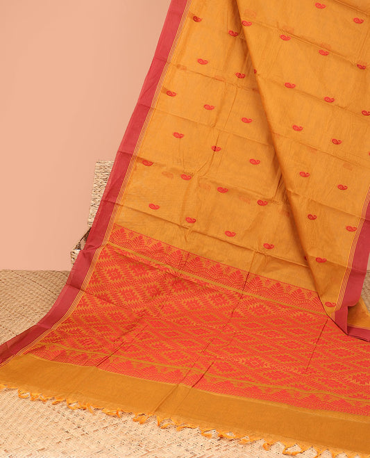 Orange kanchi cotton saree with paisley buttas, contrast border & pallu of argyle designs