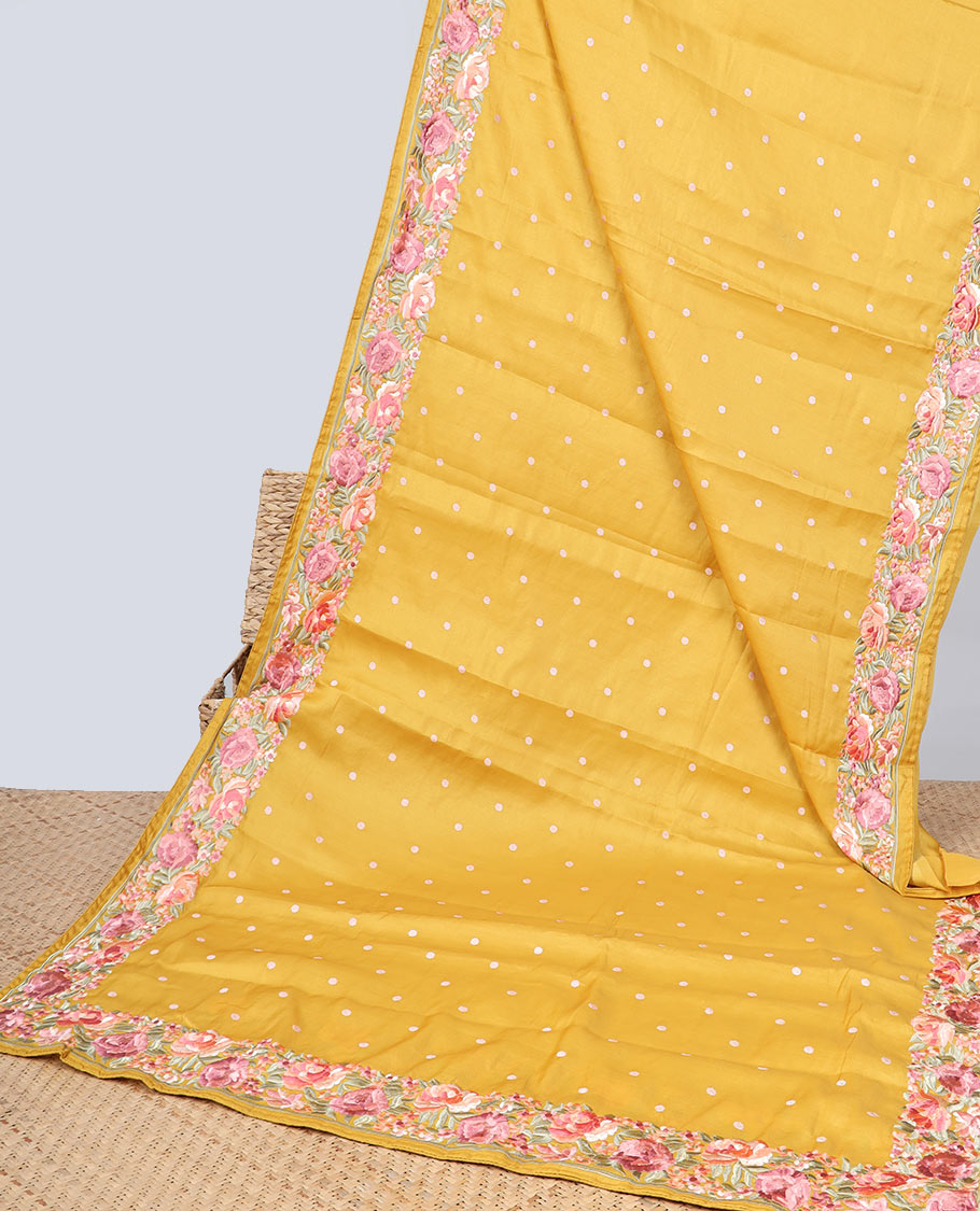 Yellow semi-banaras tussar saree with polka dots, colorful floral motifs thread embroidered border