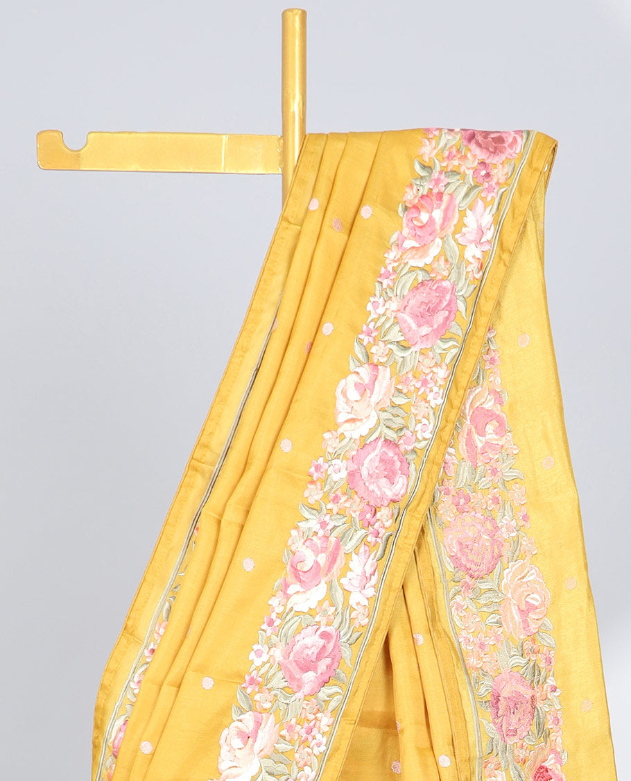 Yellow semi-banaras tussar saree with polka dots, colorful floral motifs thread embroidered border