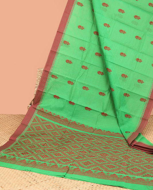 Green kanchi cotton saree with buttas, contrast plain border & jaal pallu