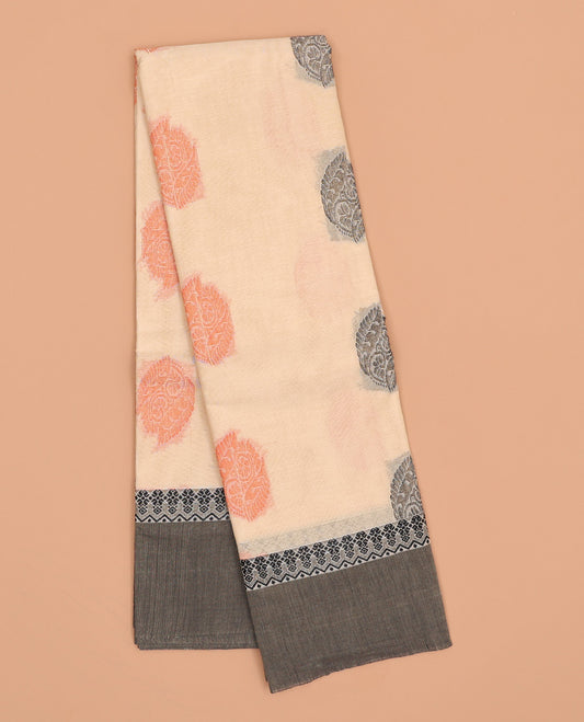 Cream kanchi cotton saree with buttas, contrast plain border & intricate design pallu 