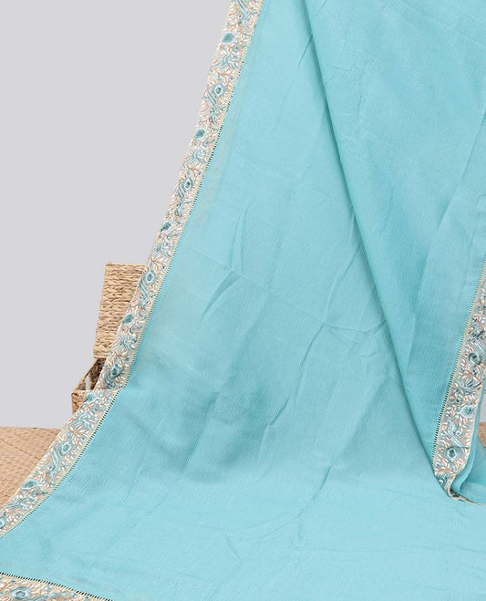 Blue plain design crushed tissue saree, contrast floral & bird embroidery border