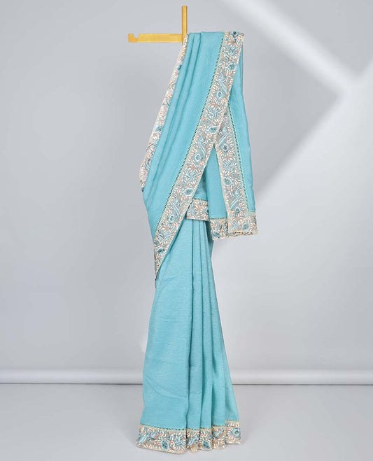 Blue plain design crushed tissue saree, contrast floral & bird embroidery border