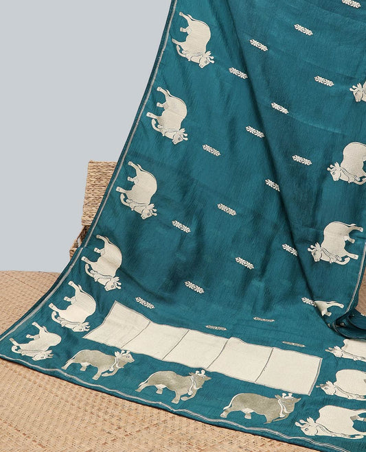Borderless blue crushed tissue saree with buttas & pichwai cow buttas, intricate pallu