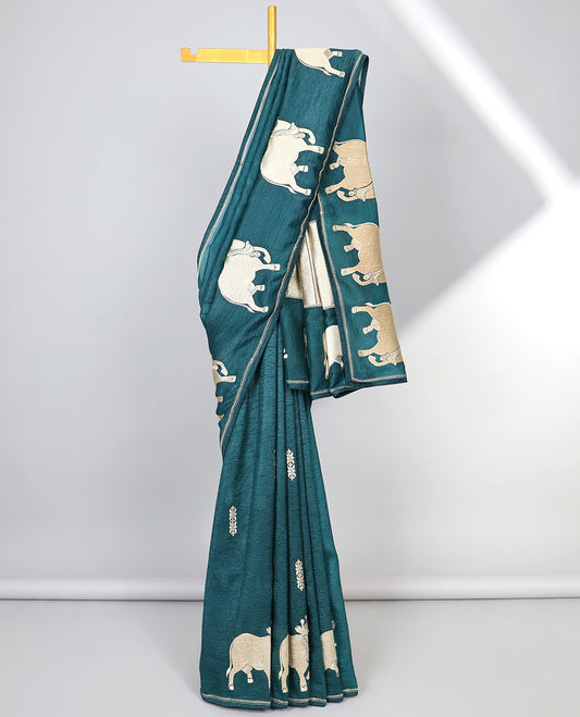 Borderless blue crushed tissue saree with buttas & pichwai cow buttas, intricate pallu