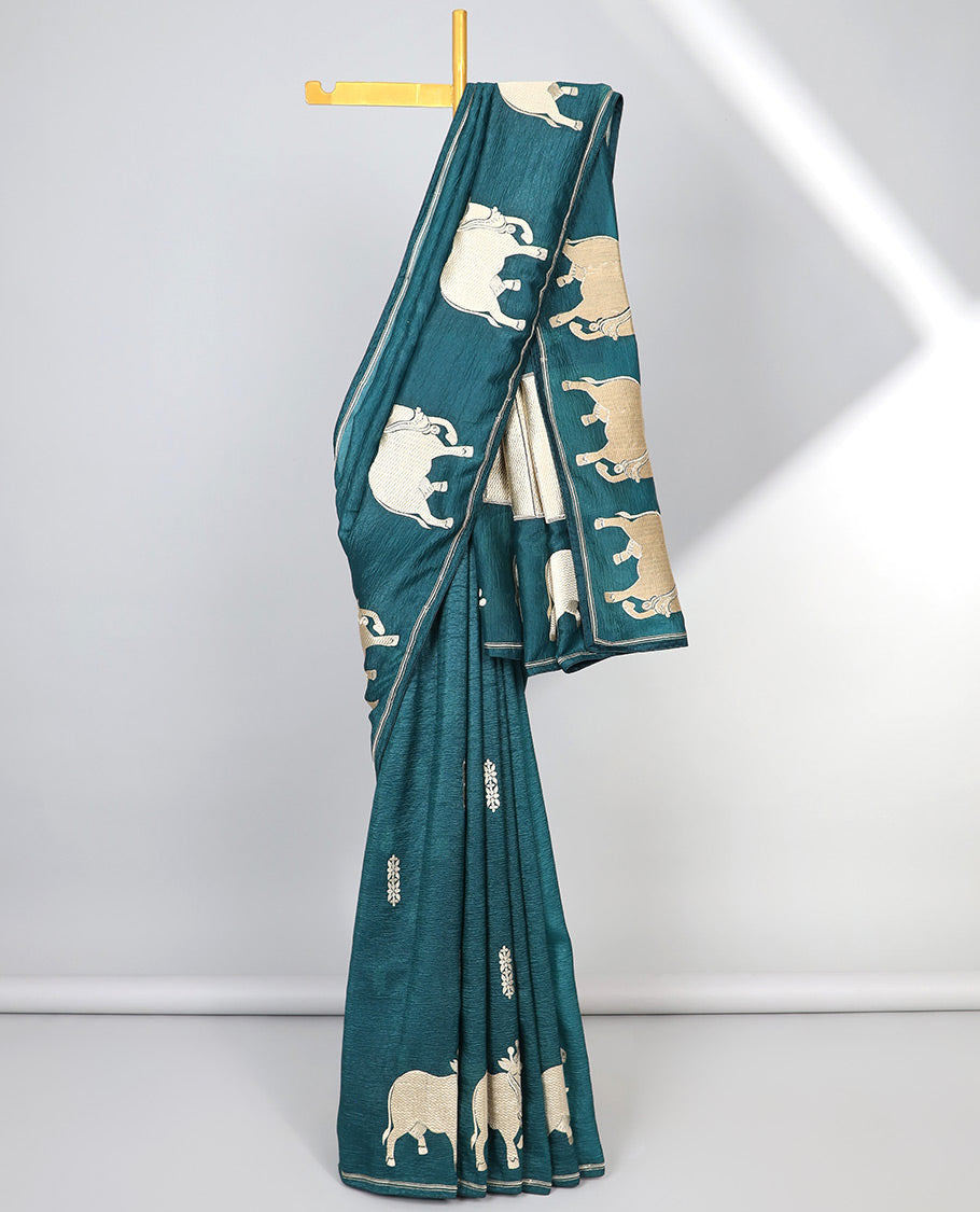 Borderless blue crushed tissue saree with buttas & pichwai cow buttas, intricate pallu