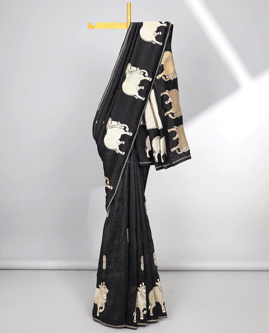 Borderless green crushed tissue saree with buttas & pichwai cow buttas, intricate pallu